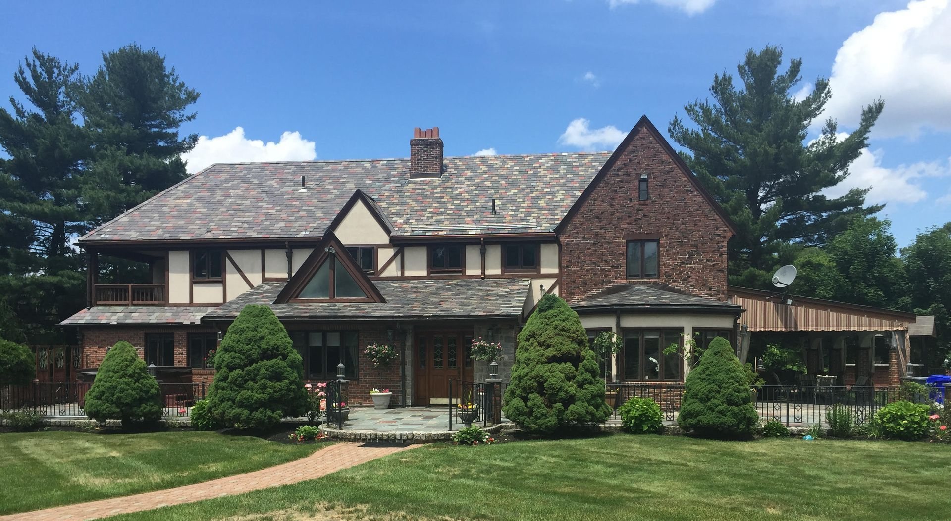 Tudor home with multi-color slate roof in Greater Boston